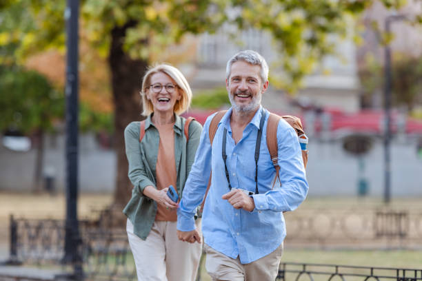 istock Mature couple enjoying a vacation stroll 2176337491