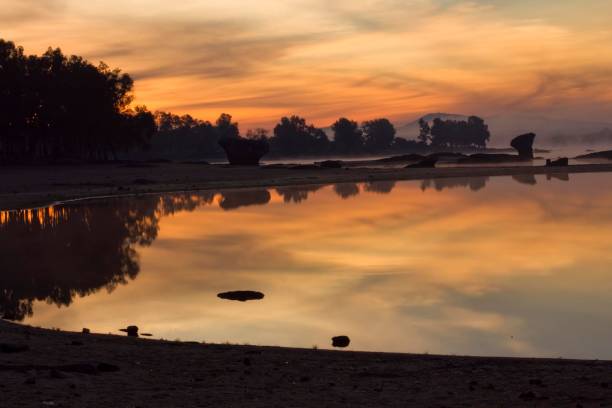 istock Serene sunset over a calm lake 2176339983