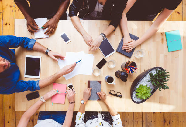 istock Multiracial team brainstorming, high angle view on the table 2176340649