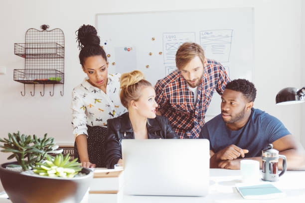 istock Start-up agency, multi ethnic team brainstorming, using laptop 2176340793