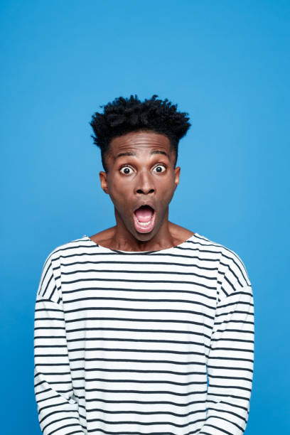 istock Shock, Afro american staring at camera with mouth open 2176341543