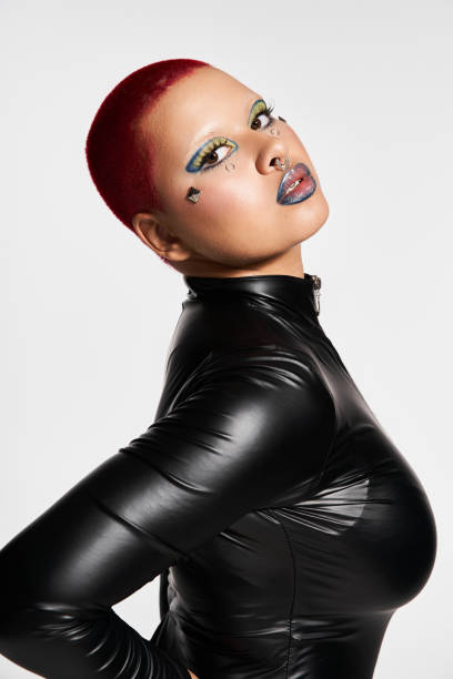 istock A young woman with pink hair radiates confidence in a stylish studio setting 2176341641