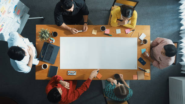 istock Top view of group walking at boardroom and brainstorming idea. Convocation. 2176353068