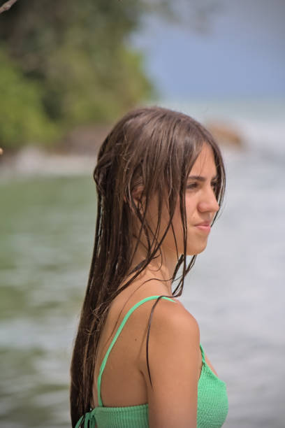 Girl head and torso in bikini on a beach close up view, Bali Indonesia