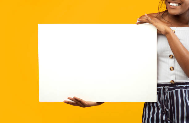istock Unrecognizable Black Girl Holding White Poster Standing, Studio Shot, Cropped 2176355633