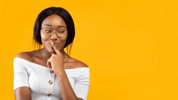 istock Afro Girl Thinking About Something Standing Over Orange Background, Panorama 2176355695