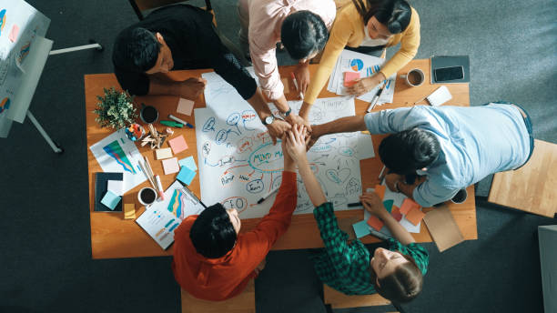 istock Group of business people writing and making mind map at meeting. Convocation. 2176356658