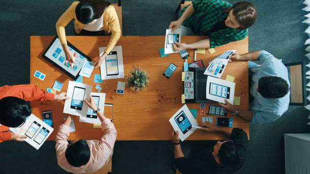 istock Top view of developer and designer shake hand together at meeting. Convocation. 2176357564