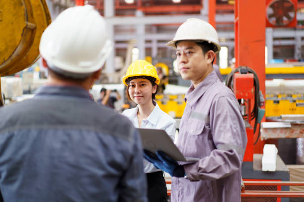 istock Industrial engineer team works together in factory. 2176358392