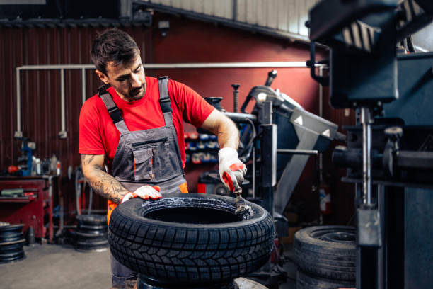 istock Servicing car wheels and mounting new tires. 2176361644
