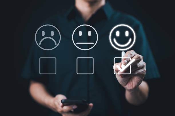 istock Customer satisfaction and feedback survey concept. A person select happy face, indicating positive feedback in customer satisfaction survey. customer experience evaluation and feedback collection. 2176363020