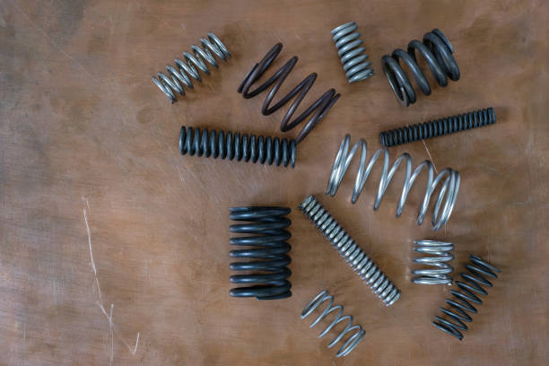 istock Different types of springs or coil springs on a copper background. 2176367106