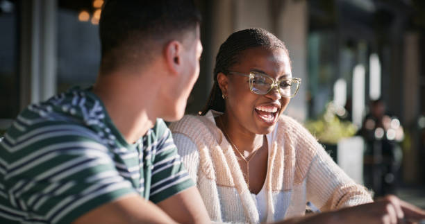 istock Education, laughing and smile with student friends on campus together for learning or study. College, school or university with man and woman learner outdoor together for development or growth 2176368265