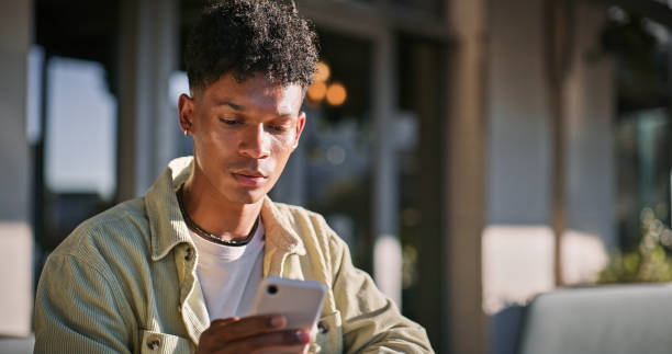 istock Serious, man and student with phone outdoor for communication, scholarship feedback and opportunity. Male person and typing on mobile app for education schedule, reading offer and university results 2176368275