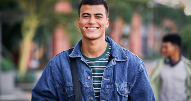 istock Knowledge, university and student in park for scholarship, education and future goals with portrait smile. Happy man, college or academy campus for learning, commute and pride with satisfaction 2176368312