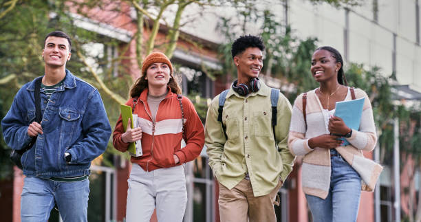 istock Group, university students and outdoor with people, chat and diversity for walking on campus. Friends, happiness and talking for education, development and scholarship for learning, college or school 2176368341