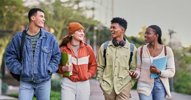 istock Group, students and outdoor with people, smile and backpacks for walking on campus or university. Friends, happy and talking for education, development and scholarship for learning, college or school 2176369367