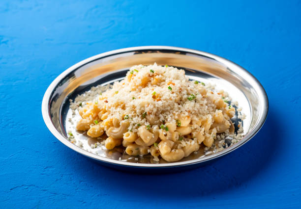 istock Truffle Mac and Cheese creamy macaroni served in plate isolated on blue background side view of italian food 2176370041
