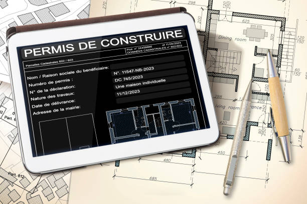 istock PERMIS DE CONSTRUIRE, BUILDINGS PERMIT CONCEPT ON DIGITAL TABLET - Residential building design, building activity and construction industry - French Language concept 2176370788