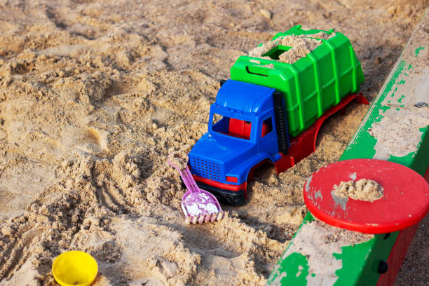 Children's toy car in the sand close up