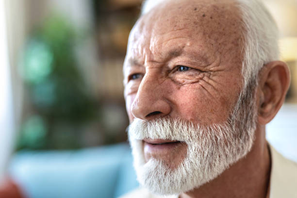 istock Dementia, eyes or nostalgia with senior man in retirement home for idea, memory or thinking. Anxiety, eyesight and mental health with elderly person in living room of apartment for planning or vision. 2176373206