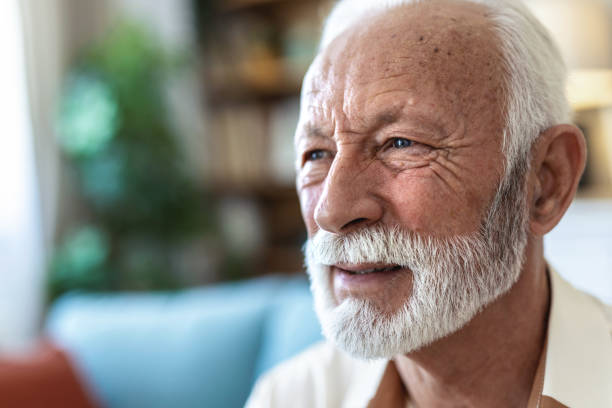 istock Thinking, memory and old man with nostalgia, lounge and nursing home on sofa to relax in lonely retirement. 2176373289
