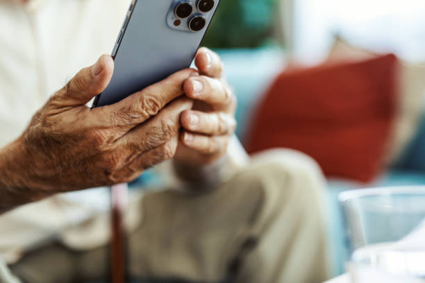 istock Laugh, cellphone and senior man texting for communication, digital conversation and online chat. Technology, notification and mobile app for male person, smile and social media for comedy streaming. 2176373476