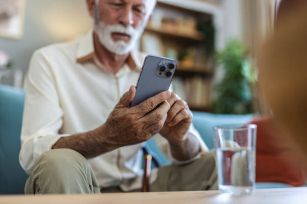 istock Laugh, cellphone and senior man texting for communication, digital conversation and online chat. Technology, notification and mobile app for male person, smile and social media for comedy streaming. 2176373580