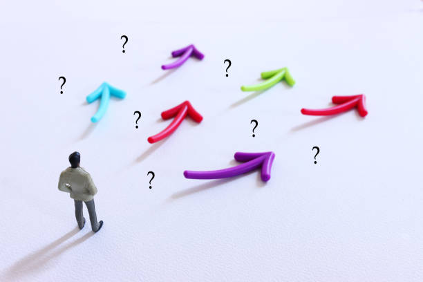 Person looking at question marks and arrows on a pastel background