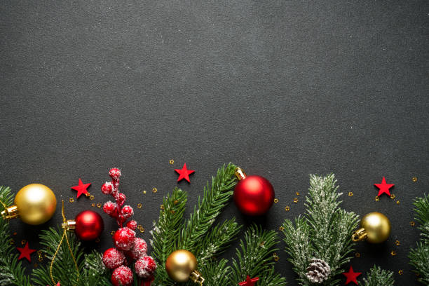 istock Christmas flat lay background with fir tree and holiday decorations on black. 2176374537