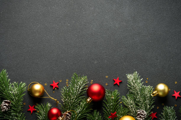 istock Christmas flat lay background with fir tree and holiday decorations on black. 2176374545