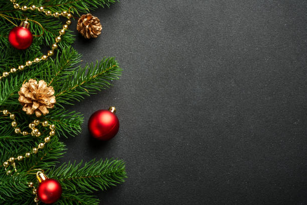 istock Christmas flat lay background with fir tree and holiday decorations on black. 2176374664