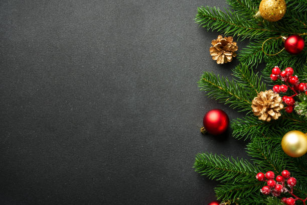 istock Christmas flat lay background with fir tree and holiday decorations on black. 2176374717