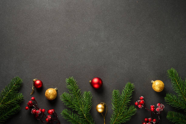 istock Christmas flat lay background with fir tree and holiday decorations on black. 2176374839
