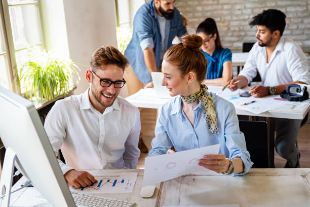 istock Group of young multi-ethnic startup business team collaborating on project in modern office 2176377417