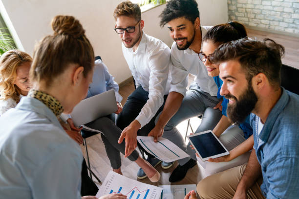 istock Group of young multi-ethnic startup business team collaborating on project in modern office 2176378961