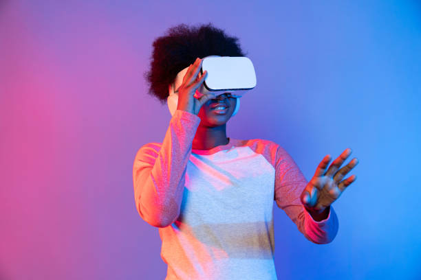 istock Young African wearing VR through meta select 3D hologram data app. Contrivance. 2176379450