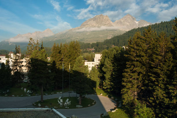 istock Relax sun loungers under alpine pine trees in St. Moritz 2176379510