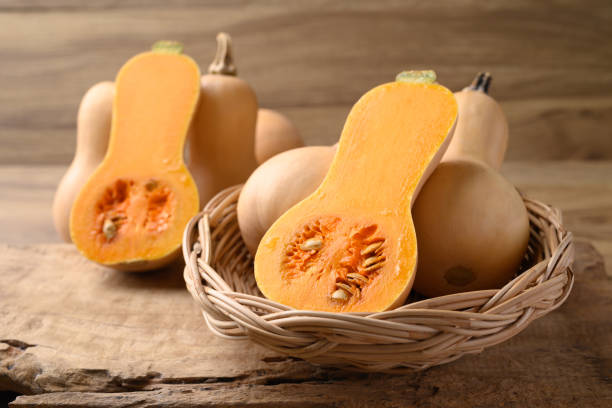 istock Butternut squash pumpkin in basket on wooden background 2176380811