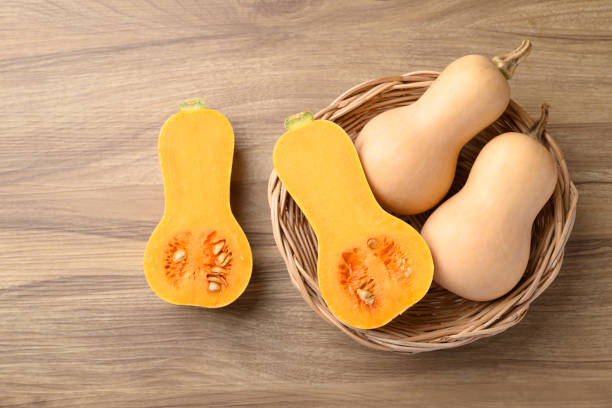 istock Butternut squash pumpkin in basket on wooden background 2176380858