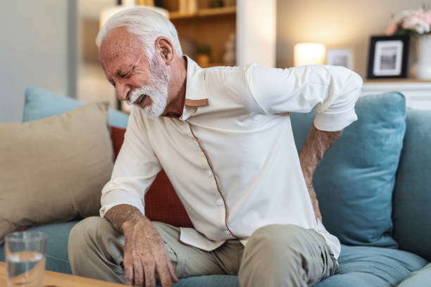 istock Senior old elderly man grandfather touching his back, suffering from backpain, sciatica, sedentary lifestyle concept. Spine health problems. Healthcare, insurance. 2176381383