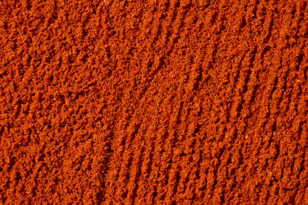 istock Ground paprika, red terracotta spice background, art in cooking. 2176383300