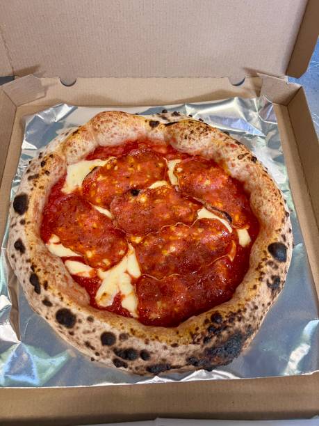 istock pizza with salami in a takeaway package 2176390396