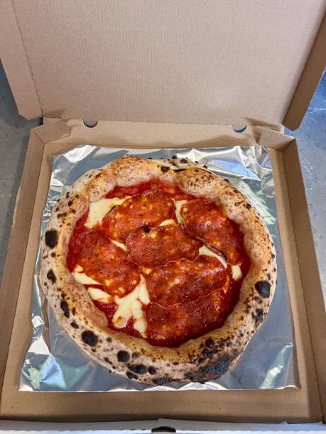 istock Pizza with spicy salami in a takeaway package 2176391264