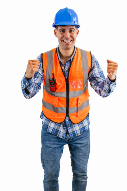 istock vertical Triumphant construction worker celebrating towards the camera with clenched fists 2176391602