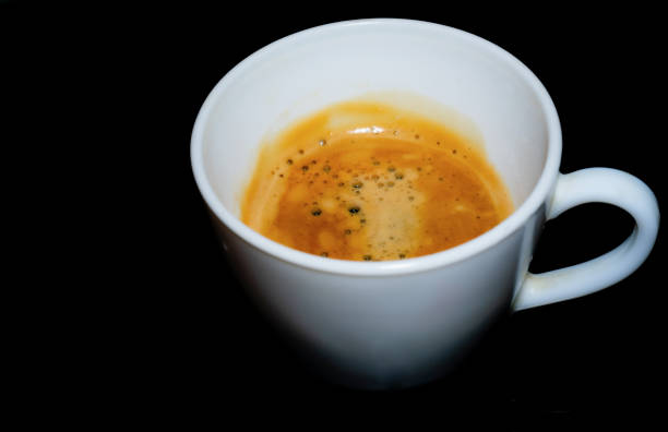 a cup of coffee on a black background