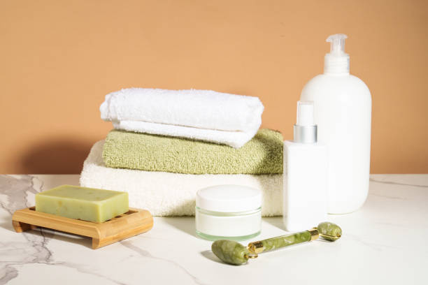 istock Face cream, serum bottle, shapmoo and stack of towels. 2176392303
