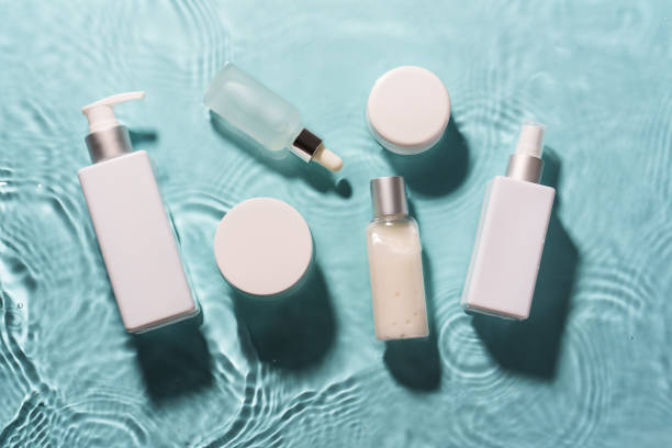 istock Natural cosmetic products in the water with waves on blue. 2176392575