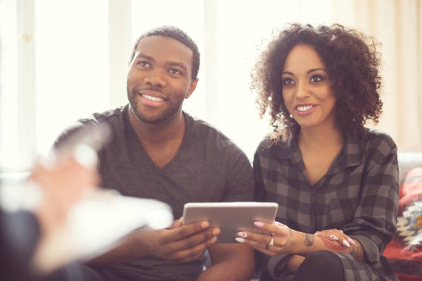 istock Afro american couple talking with financial advisor 2176397837