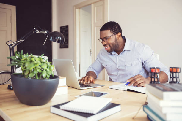 istock Afro american young man in a home office 2176398105
